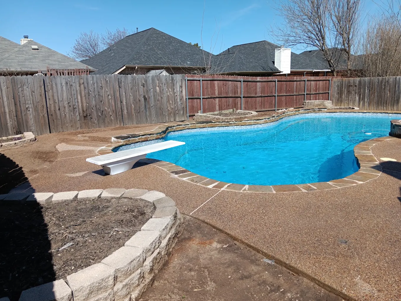 Outdoor hardscape project beside a swimming pool