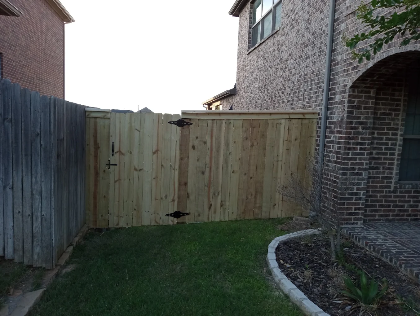 New wood fence and gate installation